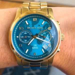 Gold Michael Kors “Watch Hunger Stop” watch